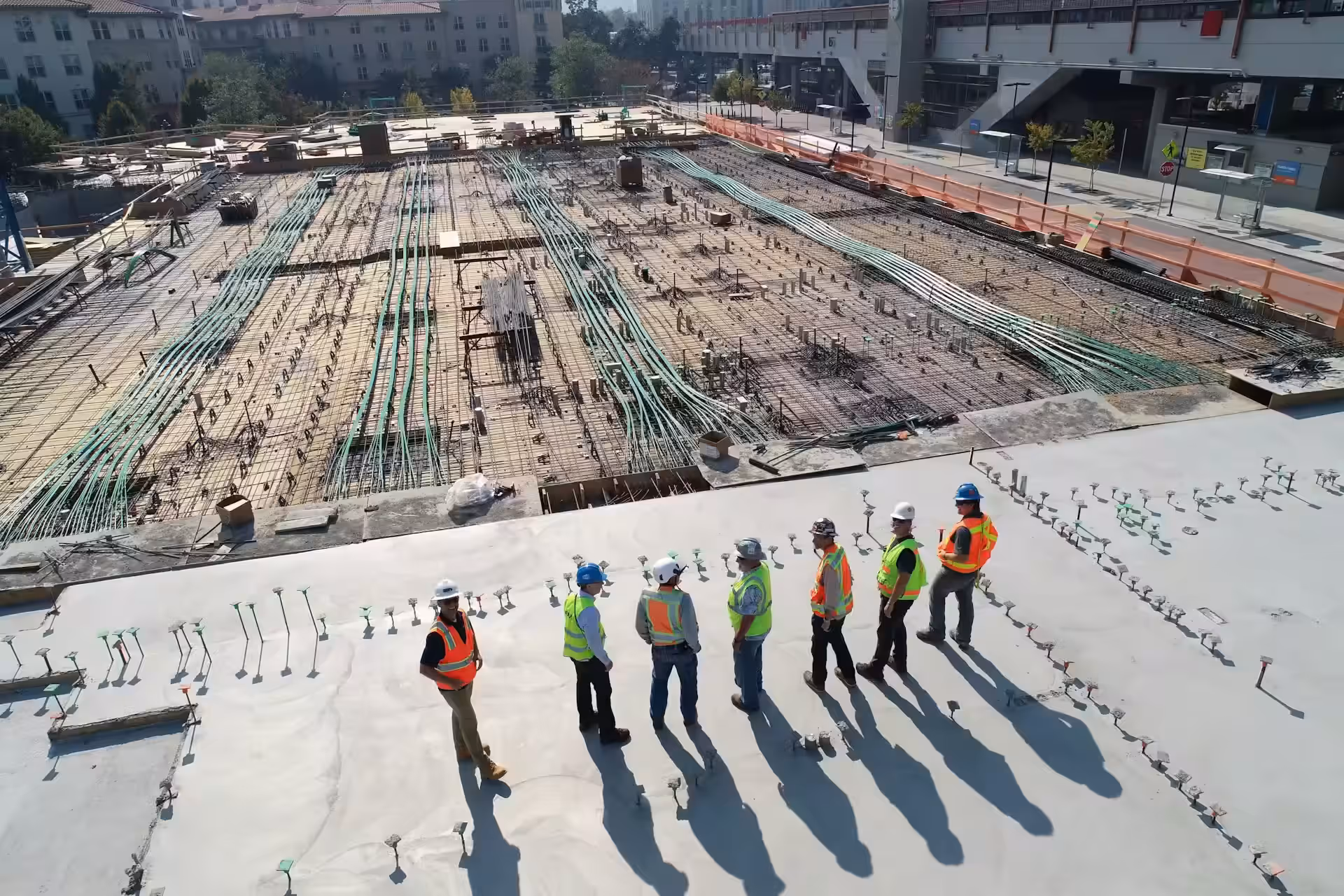 Industrial workers wearing protective equipment at a construction site