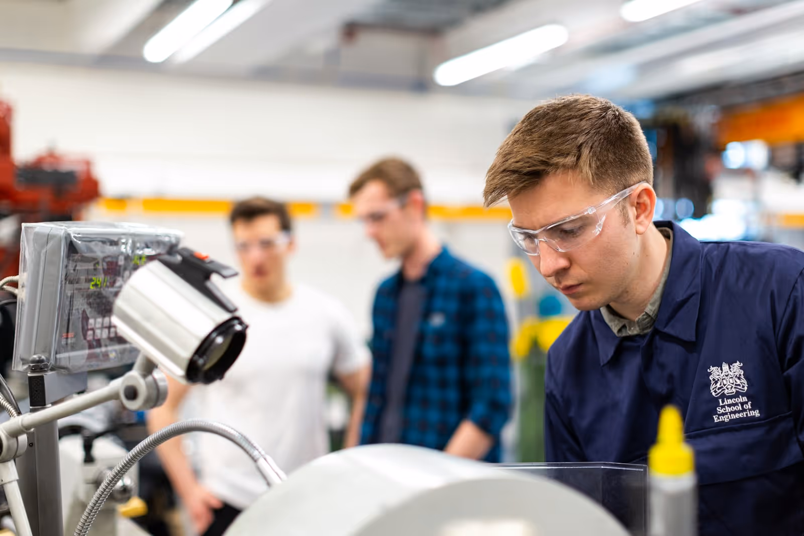 Industrial worker wearing protective equipment in a workshop